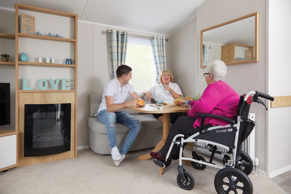 People enjoying Oakcliff's Disabled Friendly Caravan
