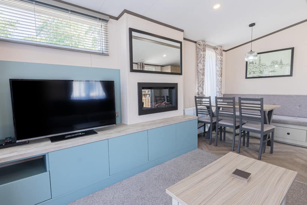 Oakcliff's Lapwing Mini Lodge living room with large TV