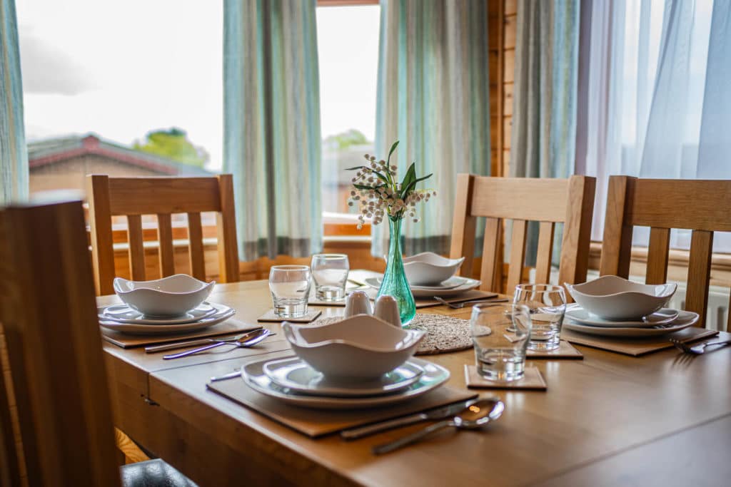 A close up of a set dining table in Oakcliff's Pine Lodge.