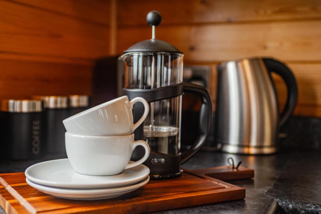 Two mugs stacked on top of each other with a cafetiere