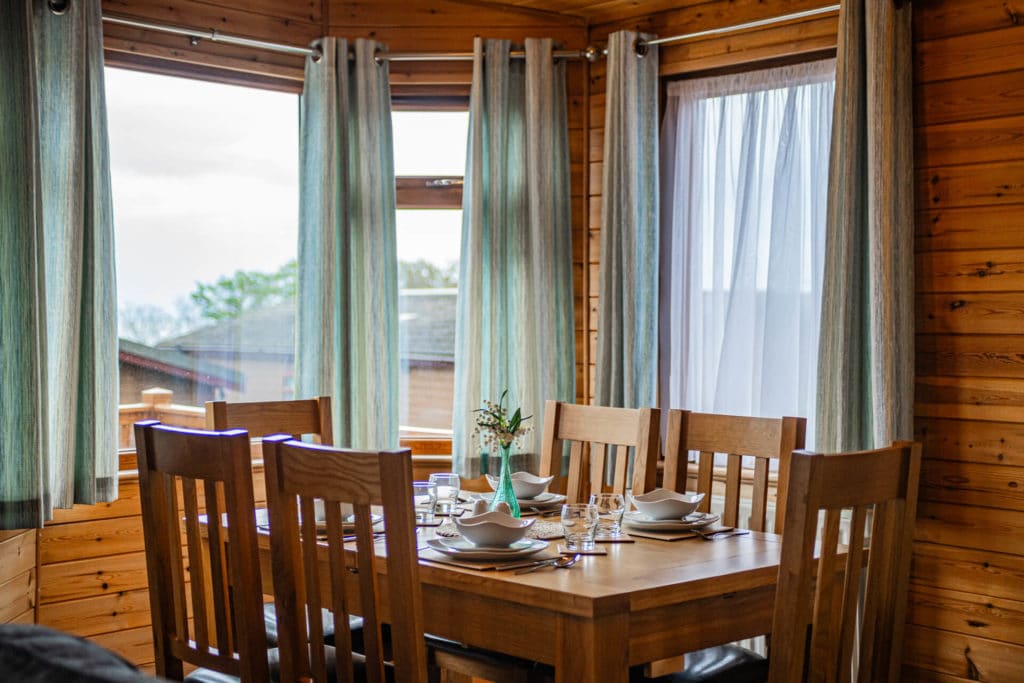 Oakcliff's Pine Lodge dining room with natural light coming through the large windows