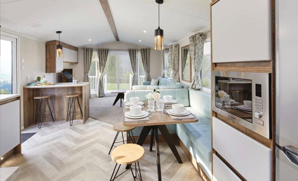 The spacious open plan living area of the Lapwing Plus mini lodge