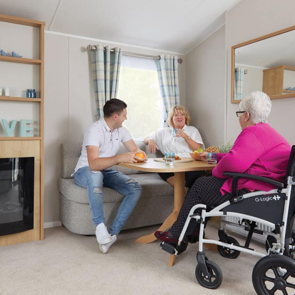 People enjoying Oakcliff's Disabled Friendly Caravan
