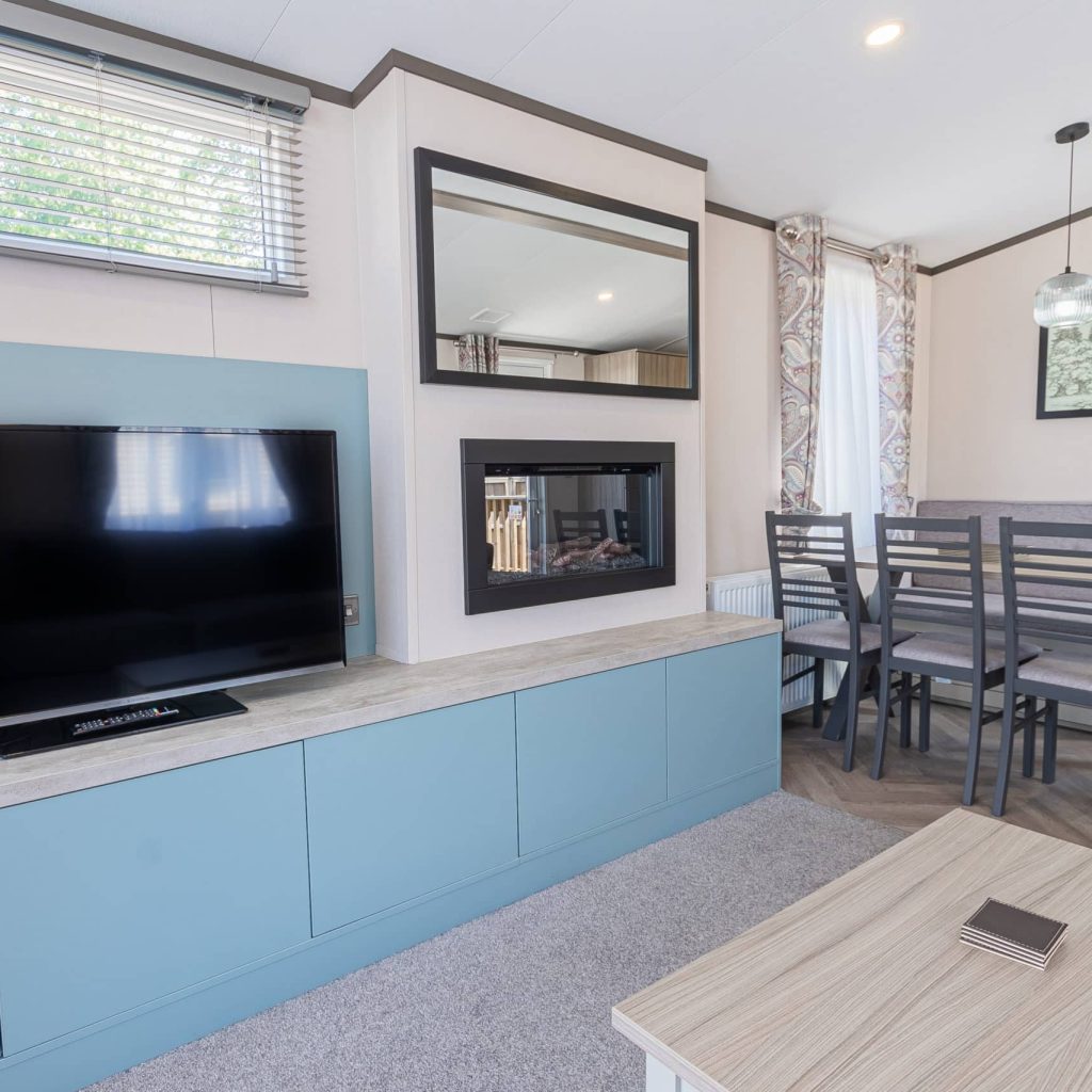 Oakcliff's Lapwing Mini Lodge living room with large TV