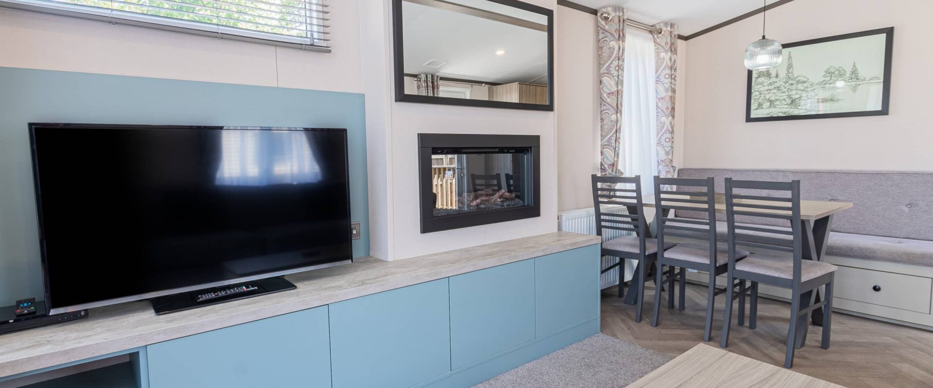 Oakcliff's Lapwing Mini Lodge living room with large TV