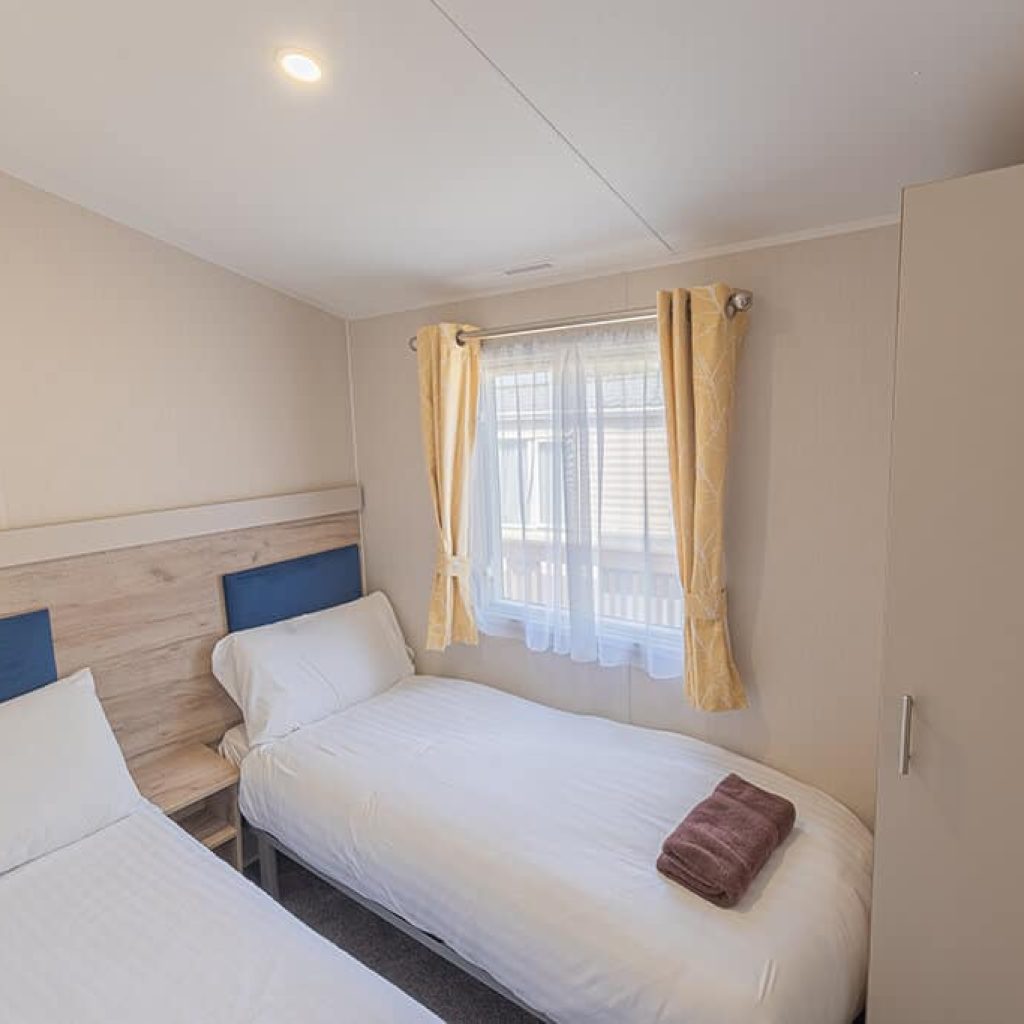Oakcliff's Wren Plus Caravan twin bedroom