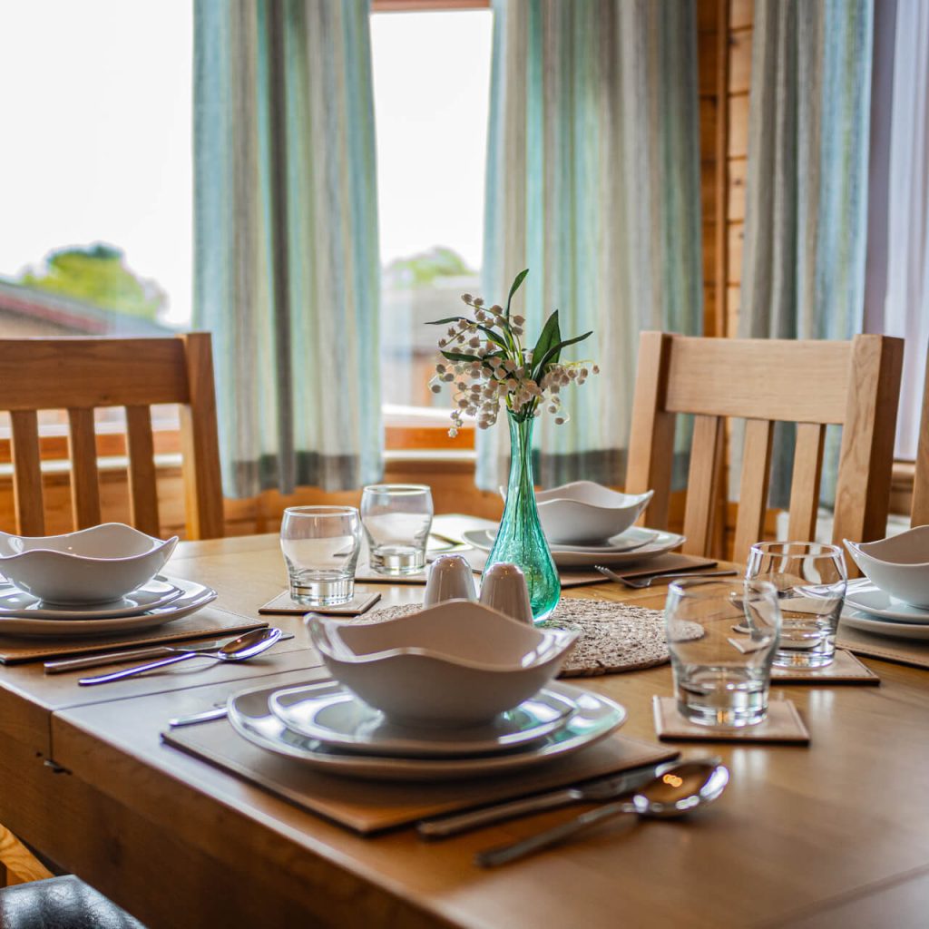 A close up of a set dining table in Oakcliff's Pine Lodge.