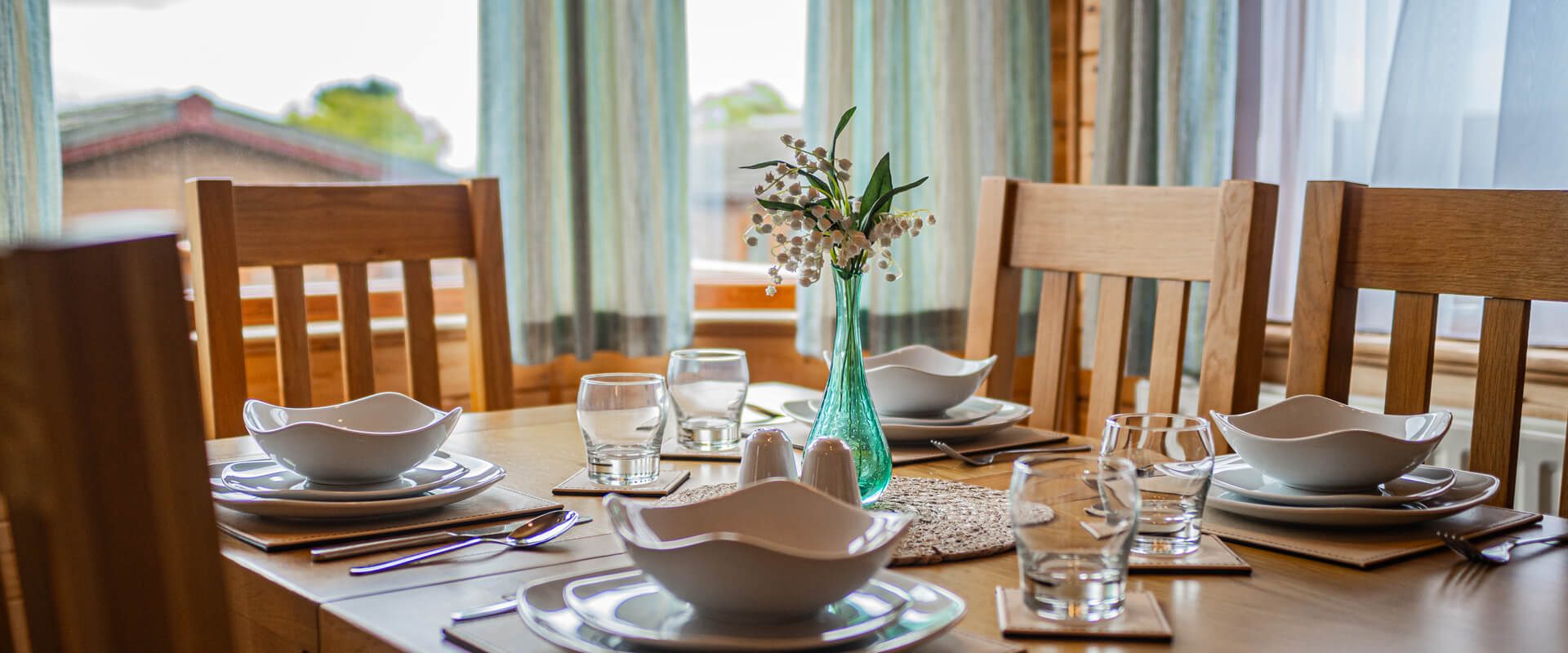 A close up of a set dining table in Oakcliff's Pine Lodge.