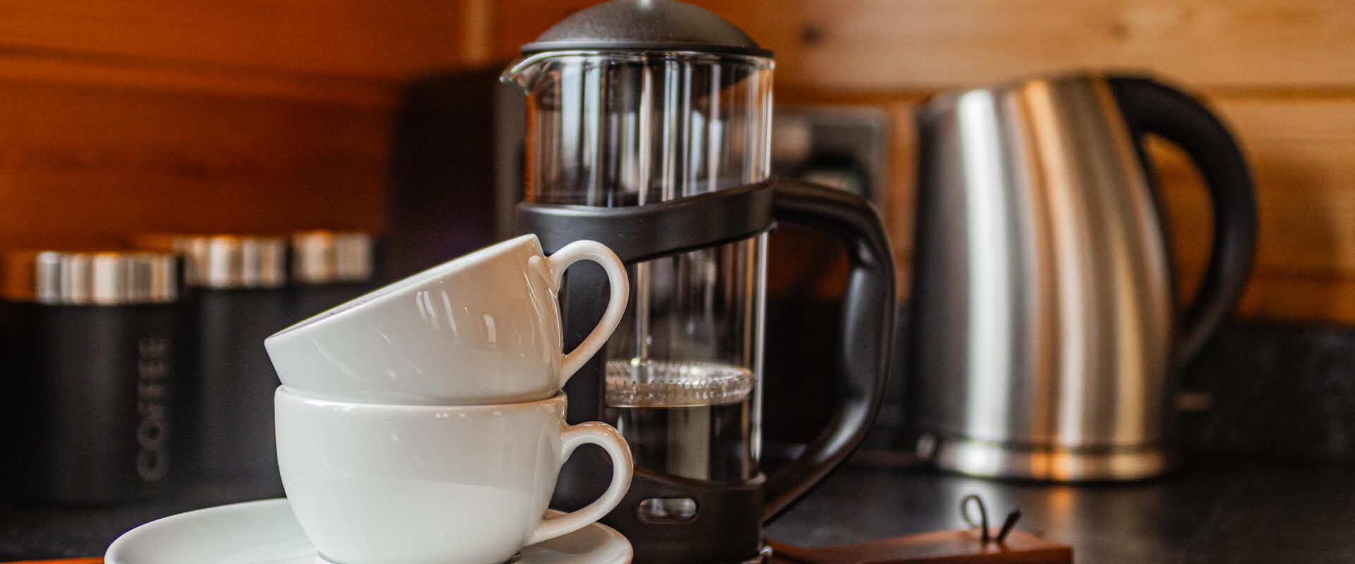 Two mugs stacked on top of each other with a cafetiere