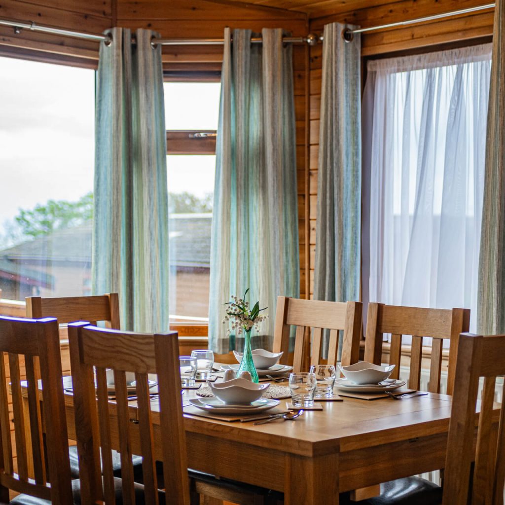 Oakcliff's Pine Lodge dining room with natural light coming through the large windows